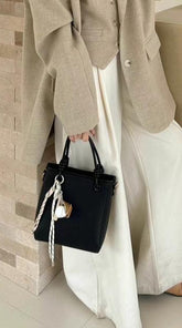 حقيبة يد نسائية صغيرة أنيقة بتصميم عقدة وحليّة جذابة لون اسود - KSA